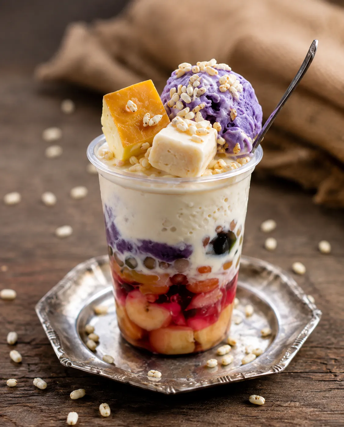 A refreshing Filipino shaved-ice dessert layered with sweet fruits, jellies, beans, creamy milk, and ube.